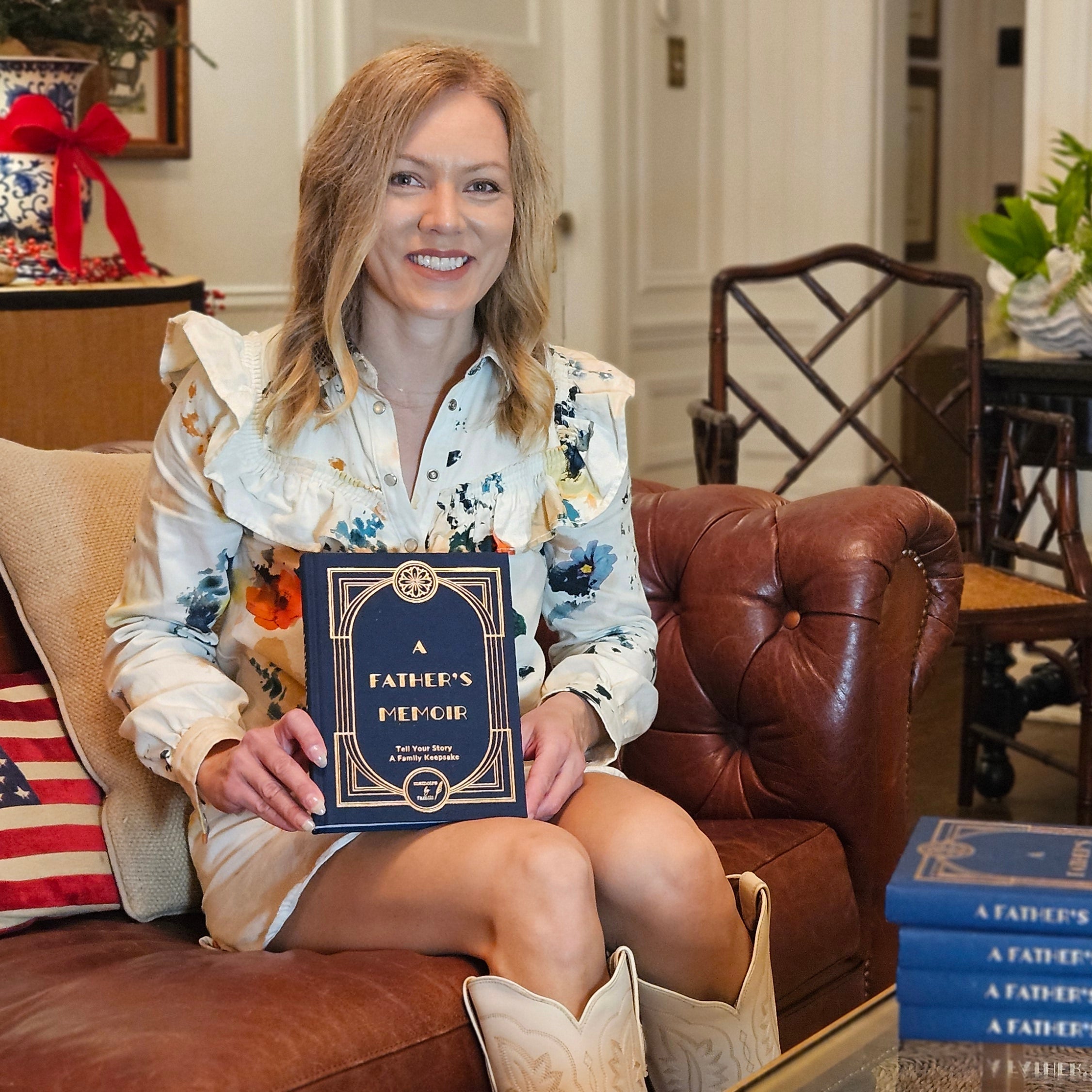 Author of A Father's Memoir Andrea Wills Bunce pictured on sofa in living room. Memoirs by Famili Books